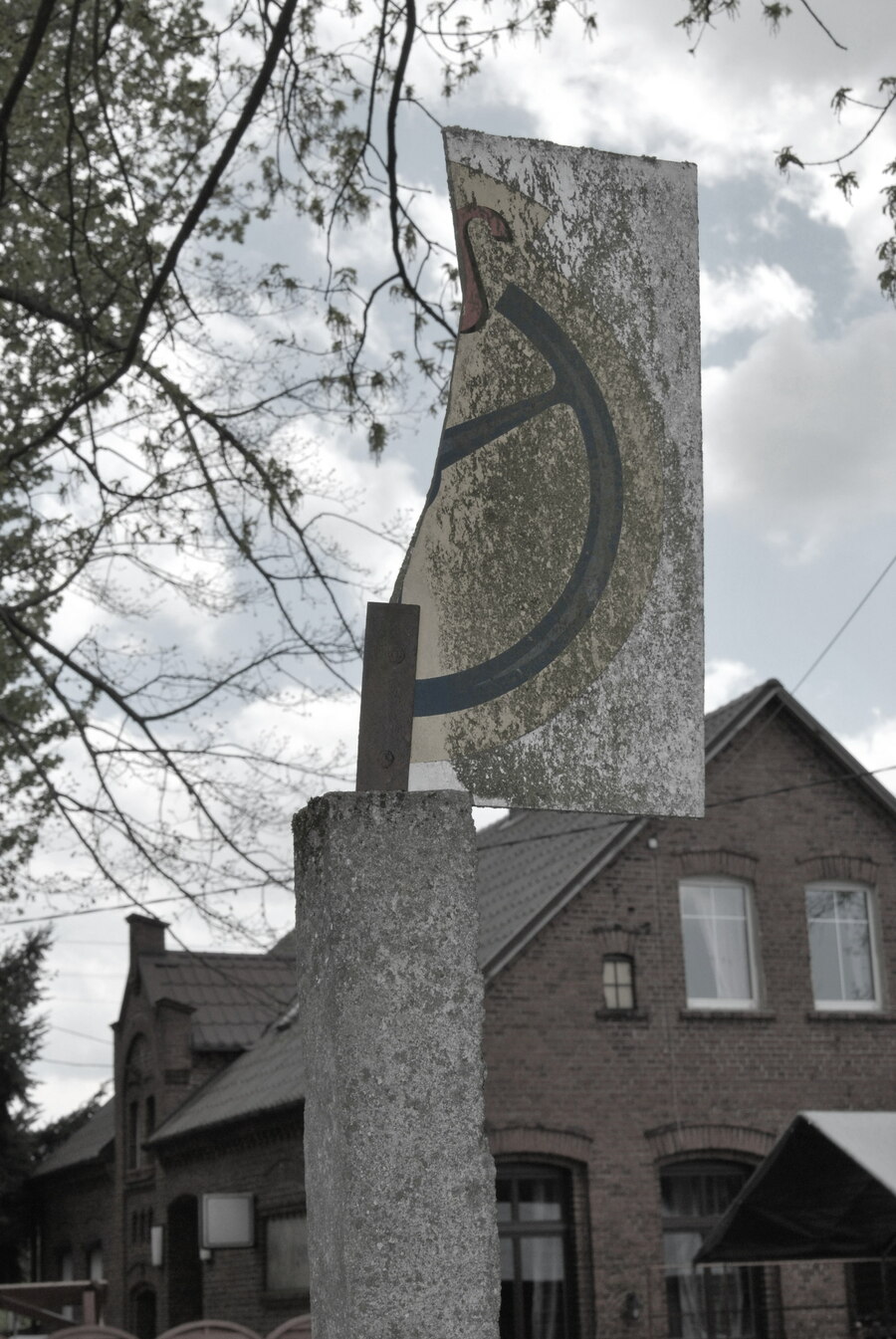 A picture of a broken bus stop sign